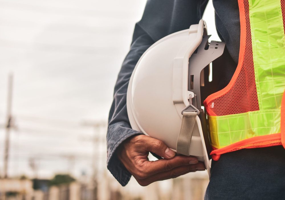 Close-Up Of Man Holding Hardhat